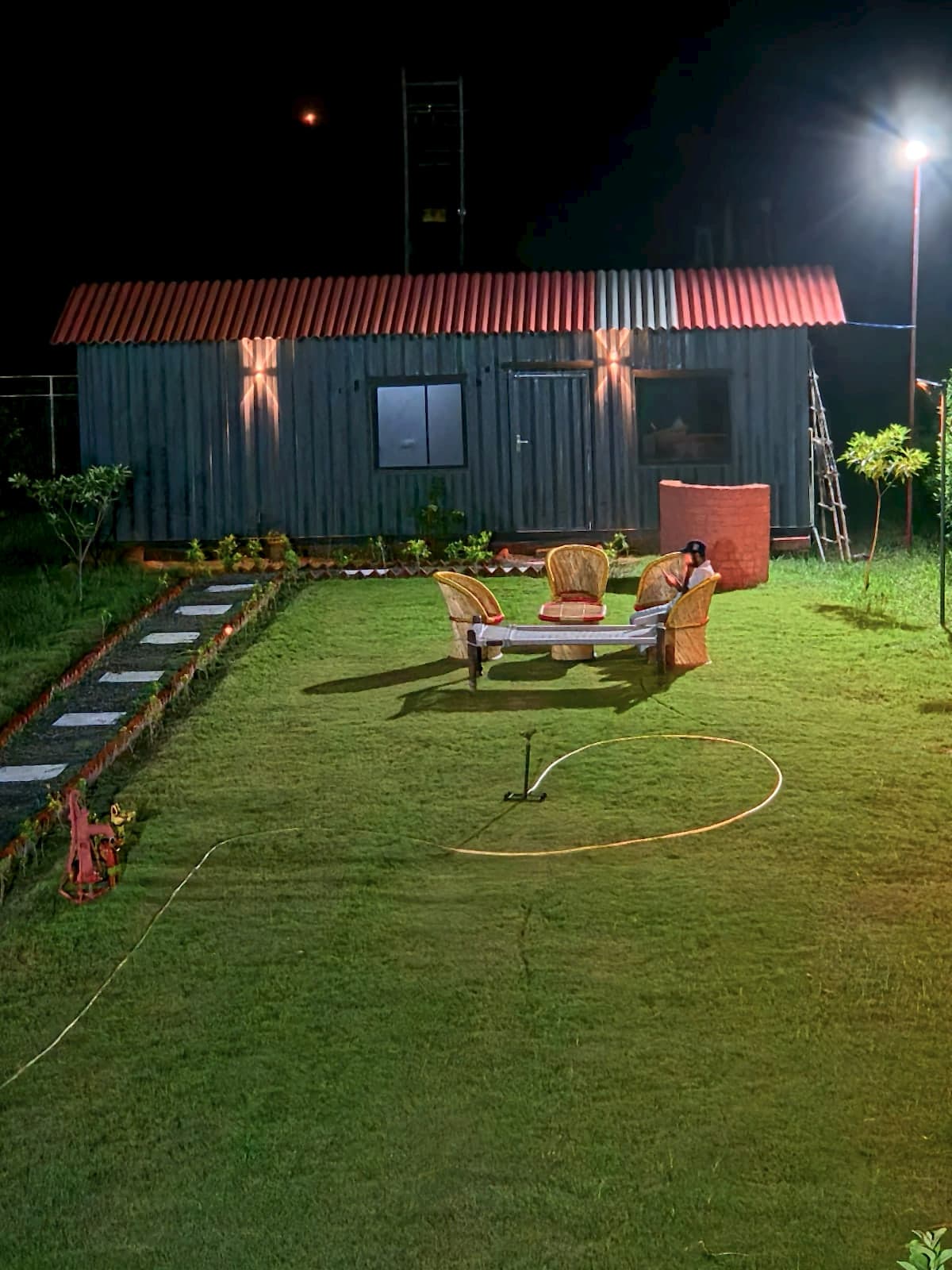 The Container House Lawn at Night